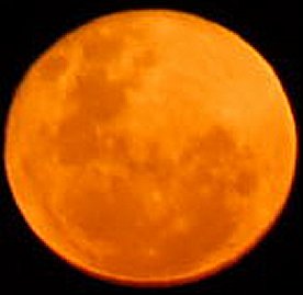Rising Moon in the Dust Zone Just above the horizon which give the Orange/Redish Glow and 1 of the Authors Favourite moon Photos on the 28/11/2012.

The other Favourite Photo is a Orange/Redish Crescent Moon either Rising or Setting.

www.skyhole.com   Photo